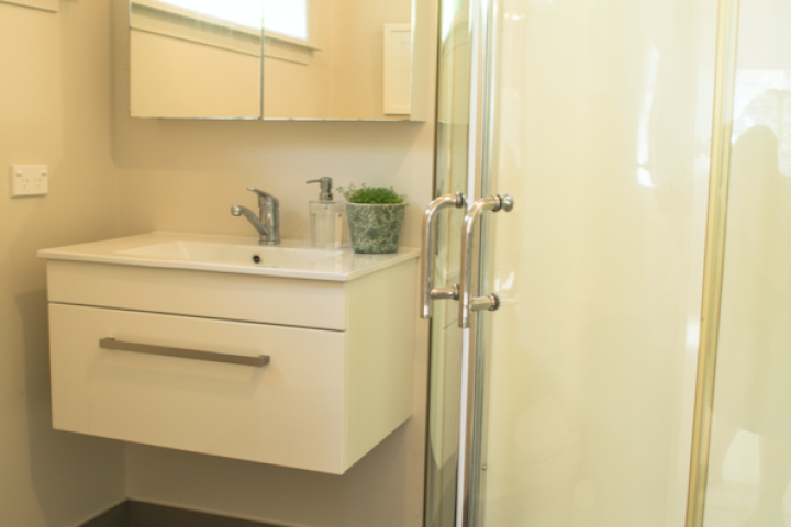 Vanity and shower in Bells family cottage Oneroa