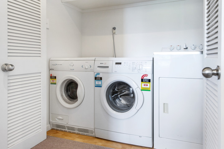 Laundry facilities in well-equipped, beachfront family home