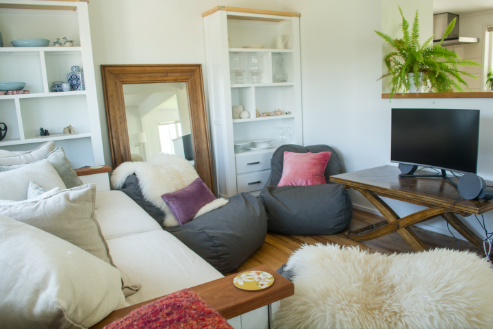 Living area with TV, bean bags and couches