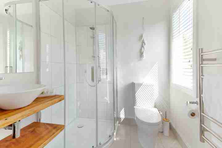 Modern ensuite bathroom at Eight on Church, view of shower, sink and toilet