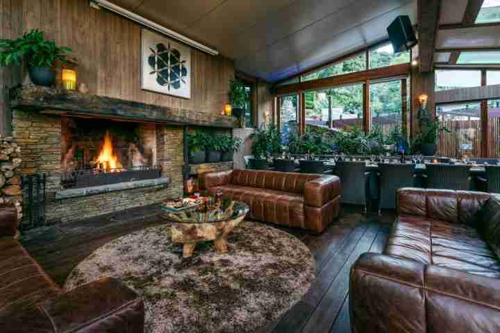 Formal atrium lounge with leather couches at Kauri Springs lodge, corporate events Waiheke