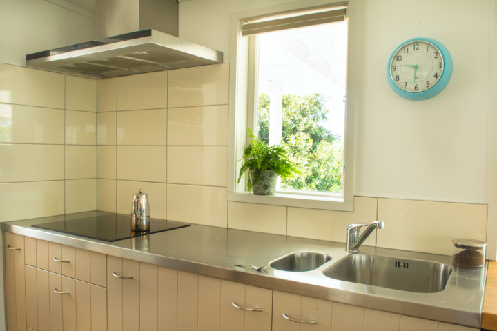 Fully-equipped kitchen at self-catered cottage Oneroa