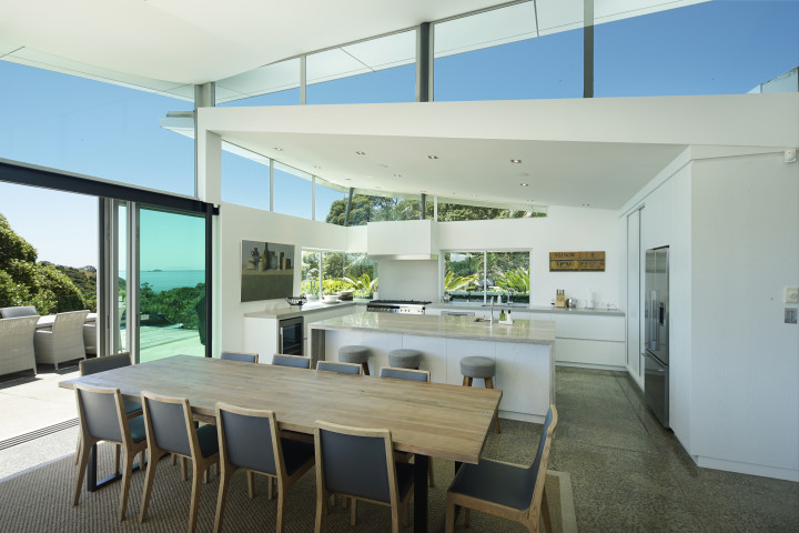 Entertain guests with open-plan kitchen and dining area and indoor outdoor flow at Korora Estate