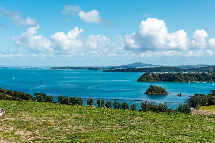 Unlimited sea views from large lawn and garden at Te Whau 
