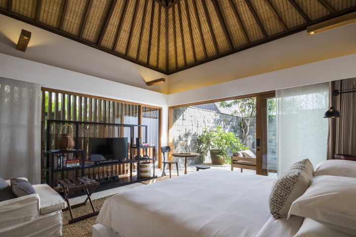 Relax in minimalist luxury in traditional Balinese style villa