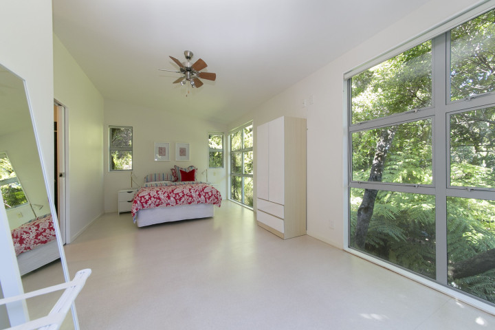Ted's Cottage spacious upstairs bedroom overlooking native bush