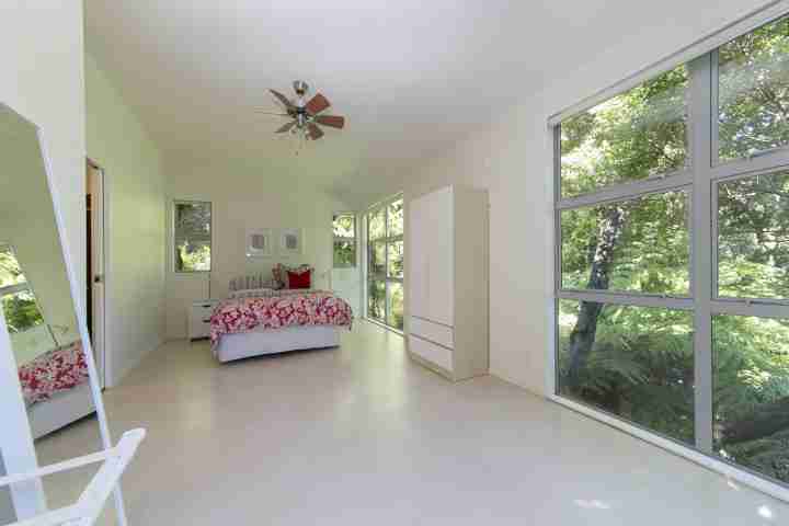 Ted's Cottage spacious upstairs bedroom overlooking native bush