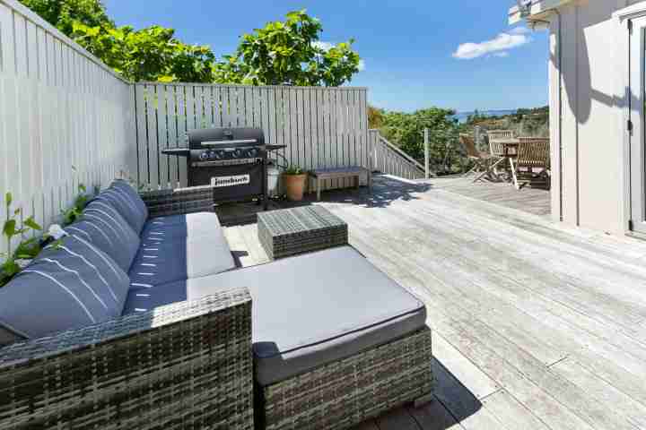 Outdoor seating and BBQ area at your Waiheke home away from home